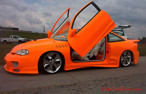 Lowriders that have been lowered, dropped, slammed, and scraping. Sweet color on the paint.