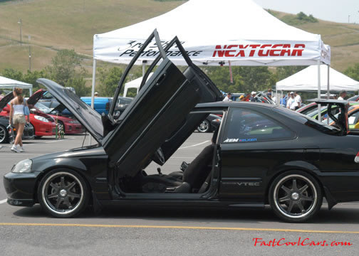 Lowriders that have been lowered, dropped, slammed, and scraping.