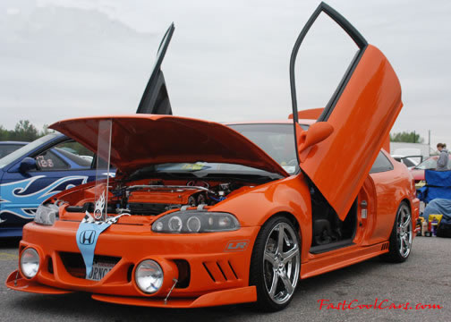 Lowriders that have been lowered, dropped, slammed, and scraping.