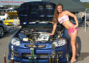 Lowriders that have been lowered, dropped, slammed, and scraping. Sexy young lady.