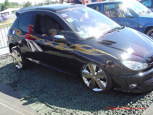 Lowriders that have been lowered, dropped, slammed, and scraping, using many different modifications.