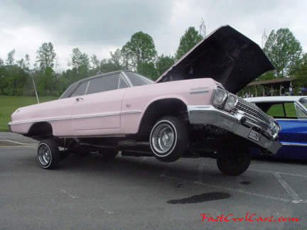 Lowriders that have been lowered, dropped, slammed, and scraping, using many different modifications.