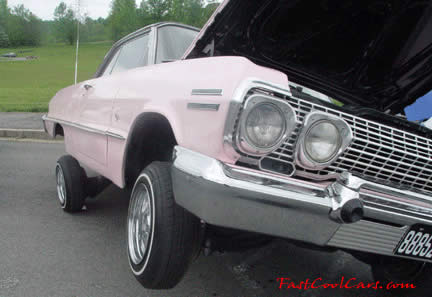 Lowriders that have been lowered, dropped, slammed, and scraping, using many different modifications.