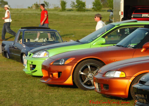 Lowriders that have been lowered, dropped, slammed, and scraping, using many different modifications.