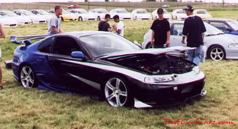 Lowriders that have been lowered, dropped, slammed, and scraping, using many different modifications. custom paint job
