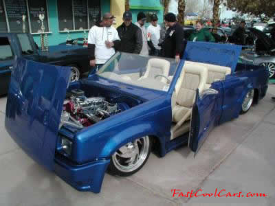 Lowriders that have been lowered, dropped, slammed, and scraping, using many different modifications.