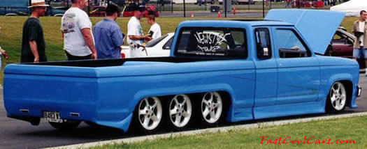 Lowrider Pick-up that has been lowered, dropped, slammed, and scraping, using many different modifications.