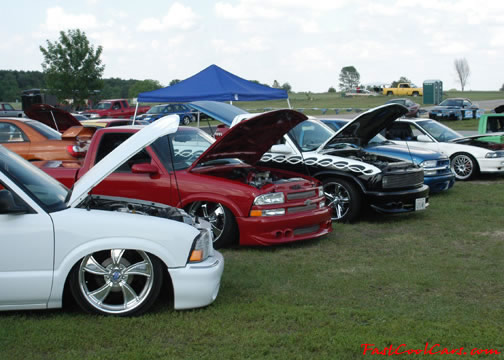 Lowriders that have been lowered, dropped, slammed, and scraping.