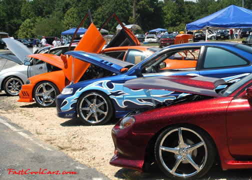 Lowriders that have been lowered, dropped, slammed, and scraping.