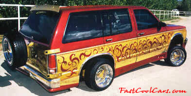 Lowriders that have been lowered, dropped, slammed, and scraping. older SUV.