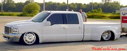 Lowriders that have been lowered, dropped, slammed, and scraping. Very low truck.