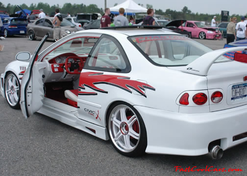 Lowriders that have been lowered, dropped, slammed, and scraping.