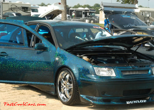 Lowriders that have been lowered, dropped, slammed, and scraping.