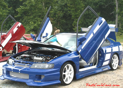 Lowriders that have been lowered, dropped, slammed, and scraping. Nice door kit.