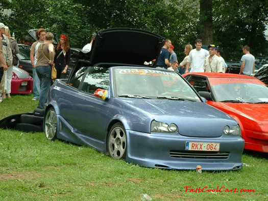 Lowriders that have been lowered, dropped, slammed, and scraping.
