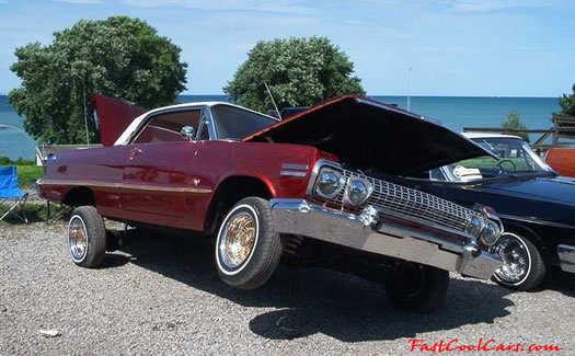 Lowriders that have been lowered, dropped, slammed, and scraping.