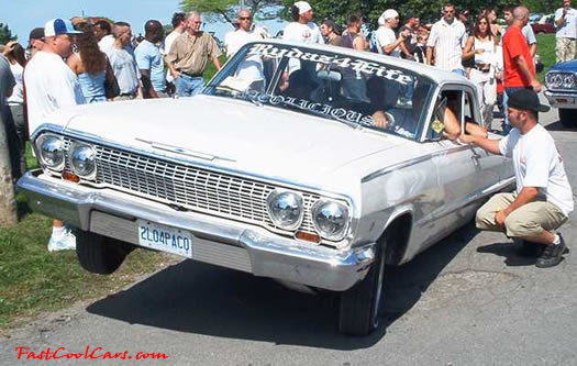 Lowriders that have been lowered, dropped, slammed, and scraping.