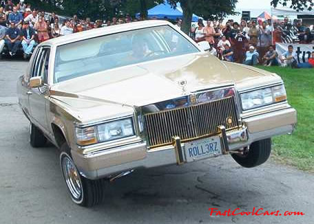 Lowriders that have been lowered, dropped, slammed, and scraping.