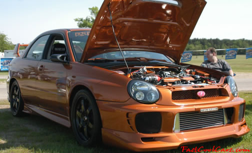 Lowriders that have been lowered, dropped, slammed, and scraping.