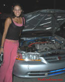Lowriders that have been lowered, dropped, slammed, and scraping. Cute young lady.