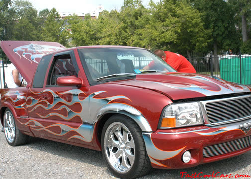 Lowriders that have been lowered, dropped, slammed, and scraping. Nice flame job.