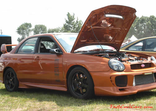 Lowriders that have been lowered, dropped, slammed, and scraping.