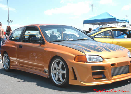 Lowriders that have been lowered, dropped, slammed, and scraping.