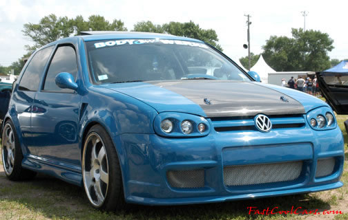 Lowriders that have been lowered, dropped, slammed, and scraping.