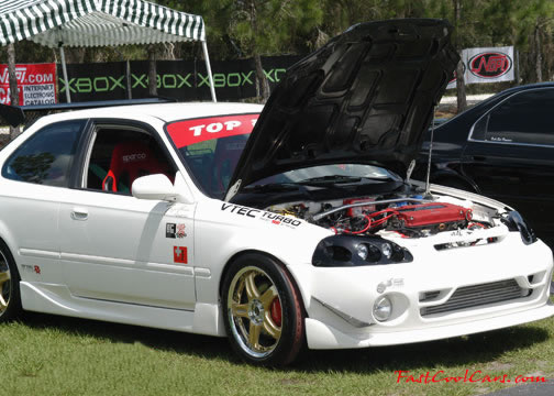 Lowriders that have been lowered, dropped, slammed, and scraping.