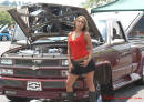 Lowriders that have been lowered, dropped, slammed, and scraping. Lowrider truck, with pretty woman.