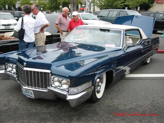 Lowriders that have been lowered, dropped, slammed, and scraping. Old lowrider classic.