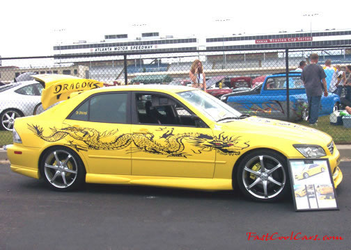 Lowriders that have been lowered, dropped, slammed, and scraping. Nice paint work.