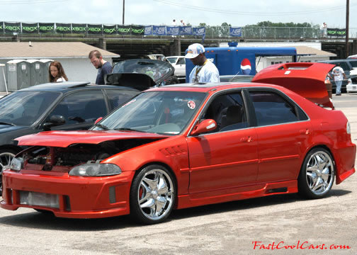 Lowriders that have been lowered, dropped, slammed, and scraping.