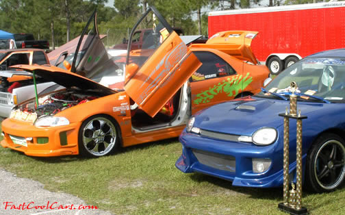 Lowriders that have been lowered, dropped, slammed, and scraping.