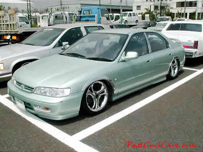 Lowriders that have been lowered, dropped, slammed, and scraping.