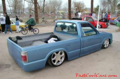 Lowrider pick-up that has been lowered, dropped, slammed, and scraping, using many different modifications.