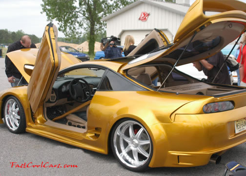 Lowriders that have been lowered, dropped, slammed, and scraping.