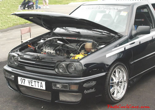 Lowriders that have been lowered, dropped, slammed, and scraping.