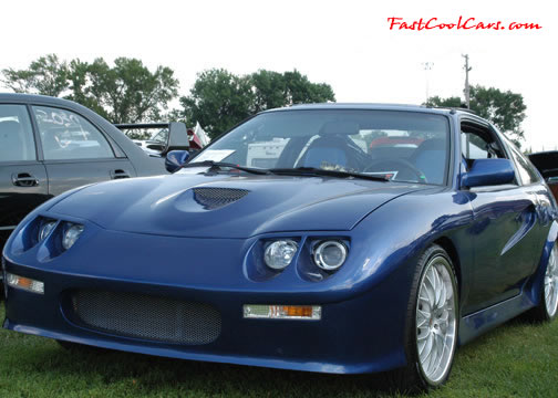 Lowriders that have been lowered, dropped, slammed, and scraping.