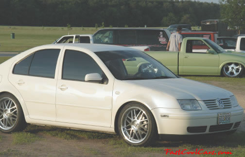 Lowriders that have been lowered, dropped, slammed, and scraping.
