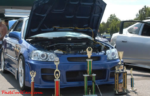 Lowriders that have been lowered, dropped, slammed, and scraping.