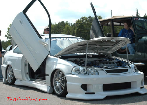 Lowriders that have been lowered, dropped, slammed, and scraping. Nice door kit.