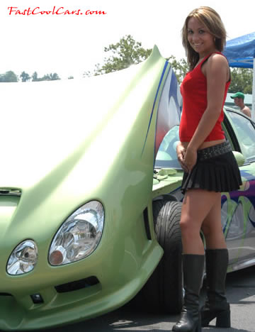 Lowriders that have been lowered, dropped, slammed, and scraping. Pretty model, and tilt hood, sweet.