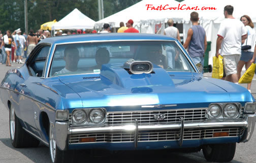 Lowriders that have been lowered, dropped, slammed, and scraping. Classic American Lowrider.