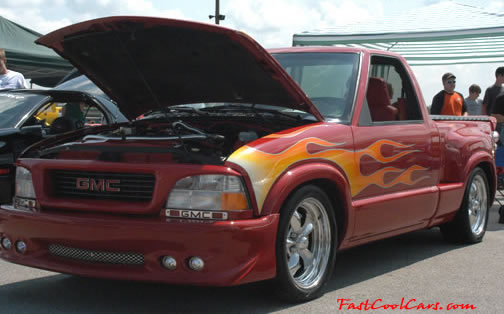 Lowriders that have been lowered, dropped, slammed, and scraping. nice flame paint job.