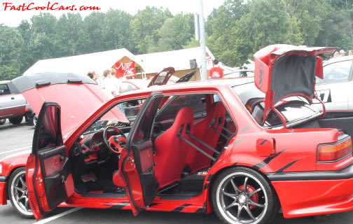 Lowriders that have been lowered, dropped, slammed, and scraping. Nice paint job, even in the door jambs.