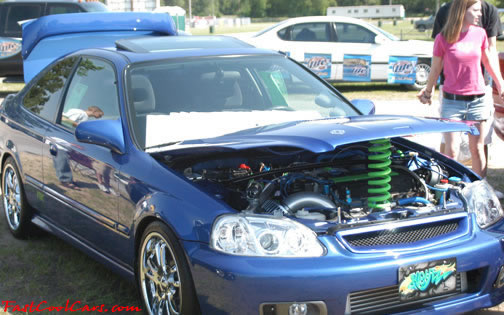Lowriders that have been lowered, dropped, slammed, and scraping.