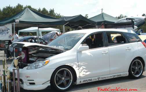 Lowriders that have been lowered, dropped, slammed, and scraping.