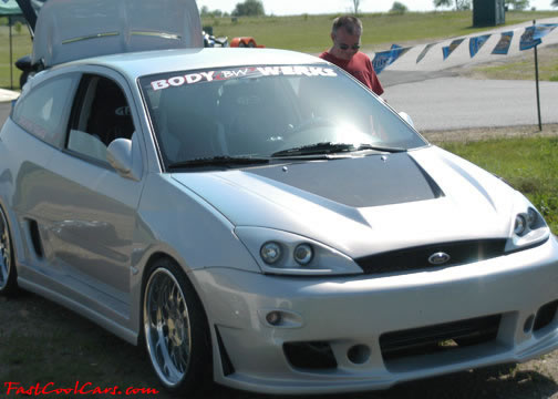 Lowriders that have been lowered, dropped, slammed, and scraping. Slick.