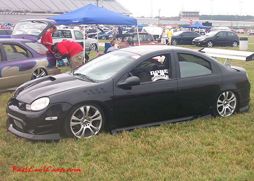 Lowriders that have been lowered, dropped, slammed, and scraping.